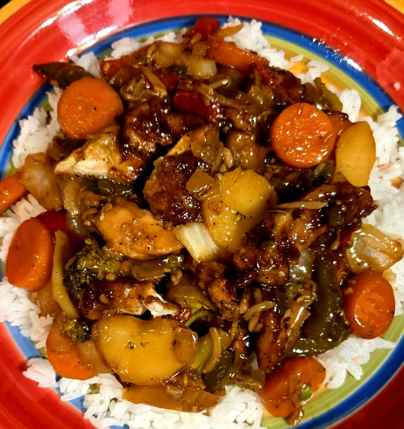 Braised meat and vegetables over white rice